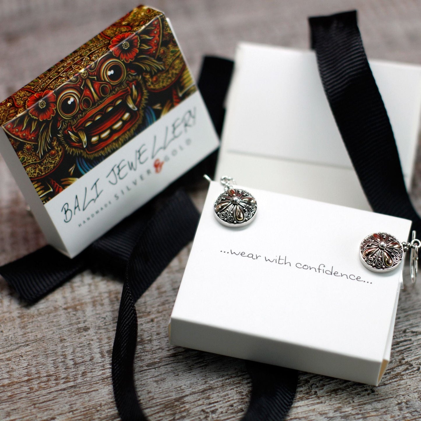 Alt Tag: 925 Silver & 18K Gold Hamsa Earrings – Hook 2.5CM on jewelry gift box packaging, close-up of hook earrings