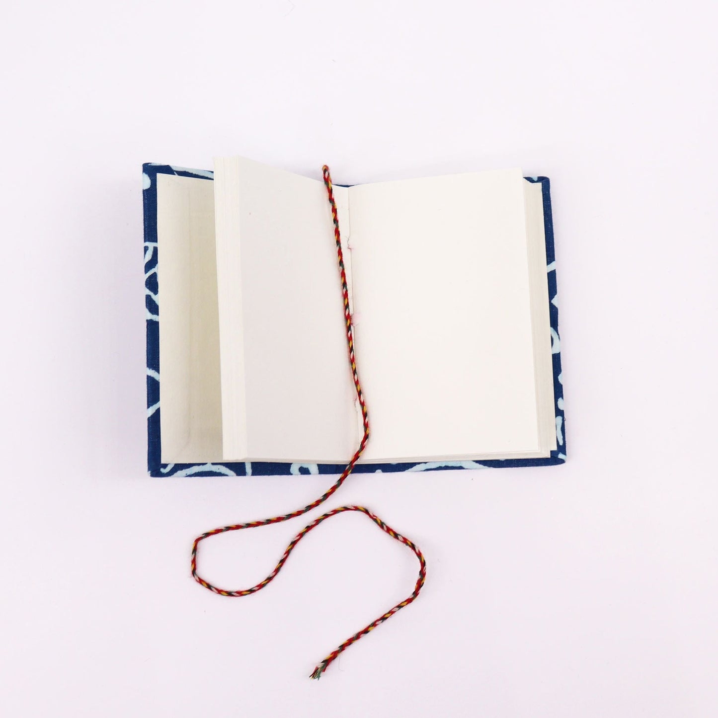 Artisan Cotton Bound Notebooks – 10x7 CM Assorted Set open notebook with hand block printed fabric cover and braided bookmark