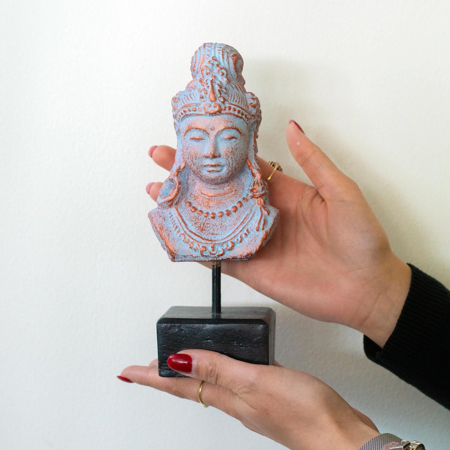 Concrete Java Princess Statue – Blue Copper concrete bust sculpture on stand with blue copper finish, held in hands