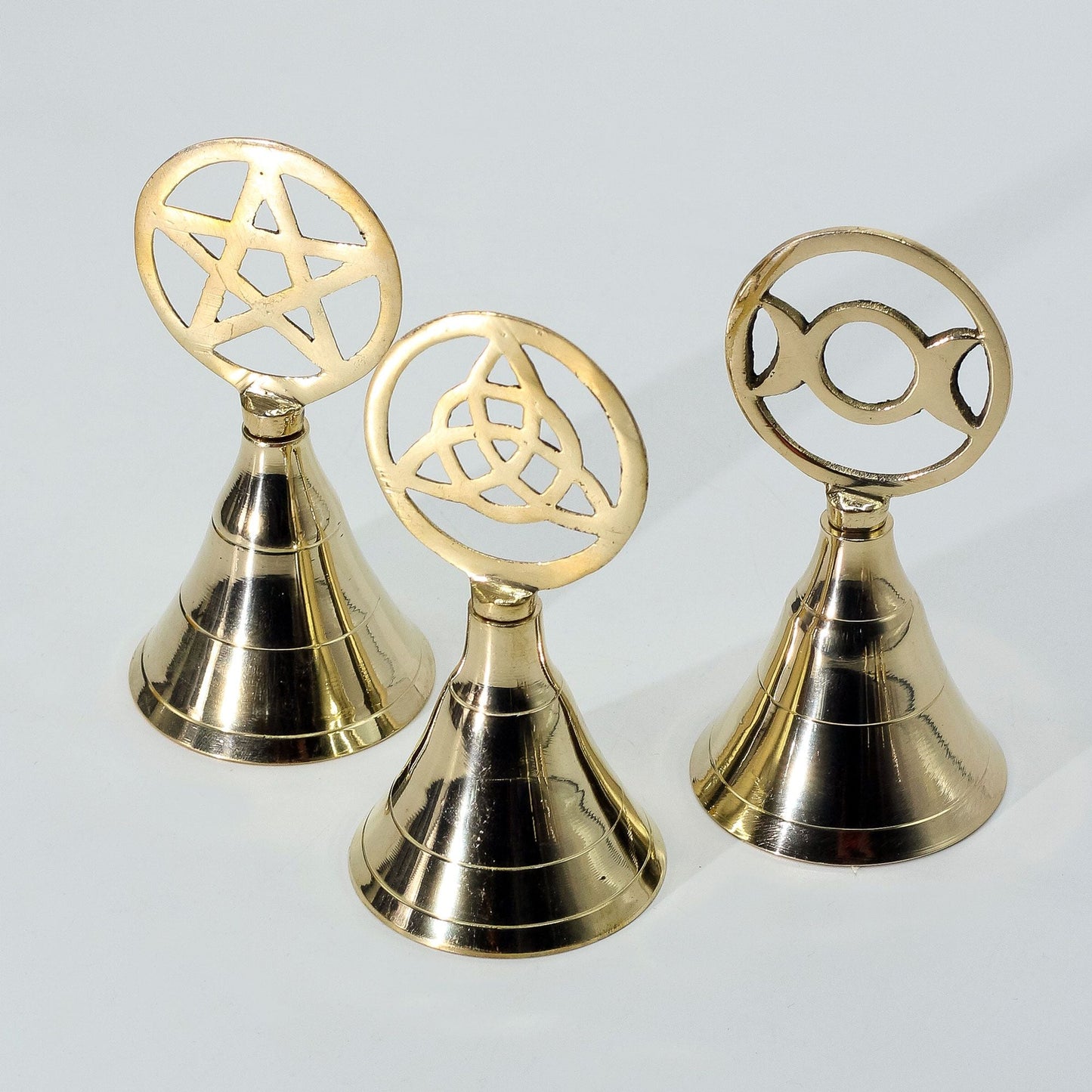 Alt Tag: Brass Altar Bell – Triple Moon solid brass ritual bell with triple moon symbol, 10.5 cm tall, resonant chime altar tool