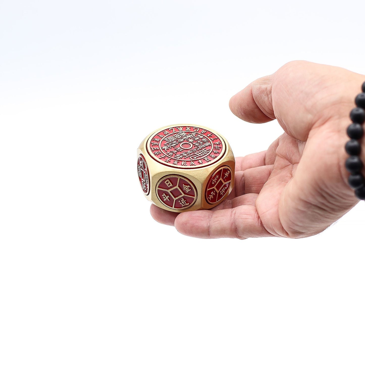 Brass Feng Shui Fortune Spinner – 5x3.2 CM in hand, brass cube spinner with Chinese coin symbols and traditional calendar design