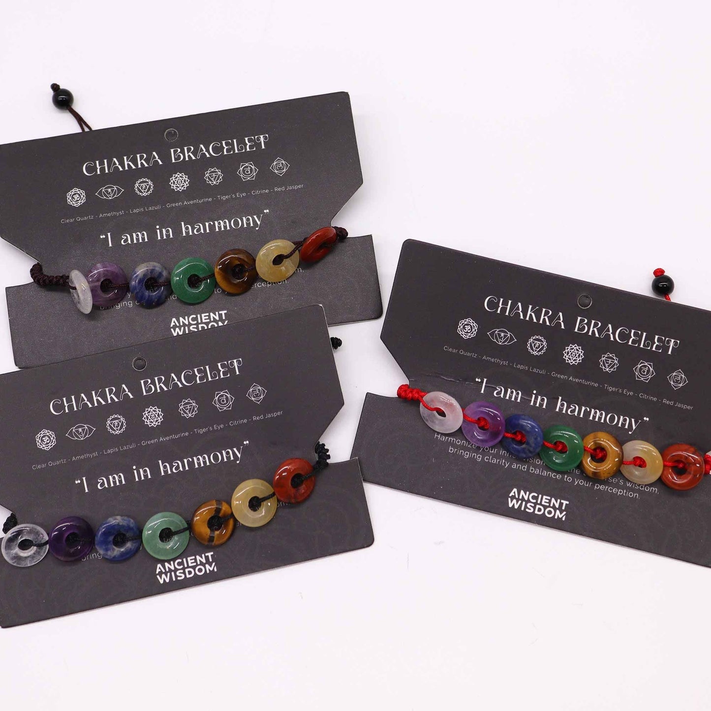 Chakra String Bracelets – Mini Donuts with seven donut-shaped gemstone beads on adjustable string, displayed on product cards