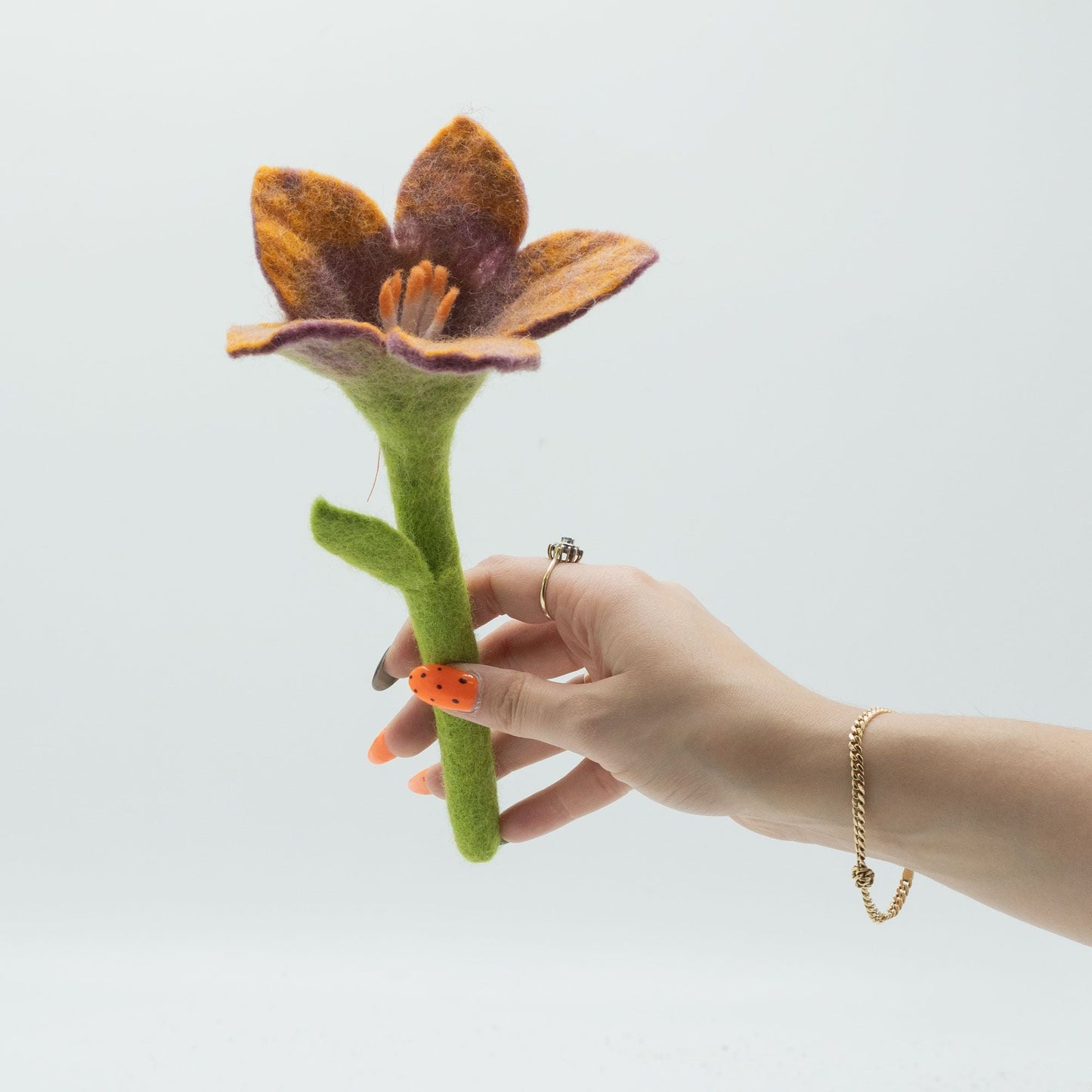 Alt Tag: Felt Lily Flowers – Assorted Colors – 6x Set, handcrafted felt lily flower stem in purple and orange held in hand, 25x10 cm decor