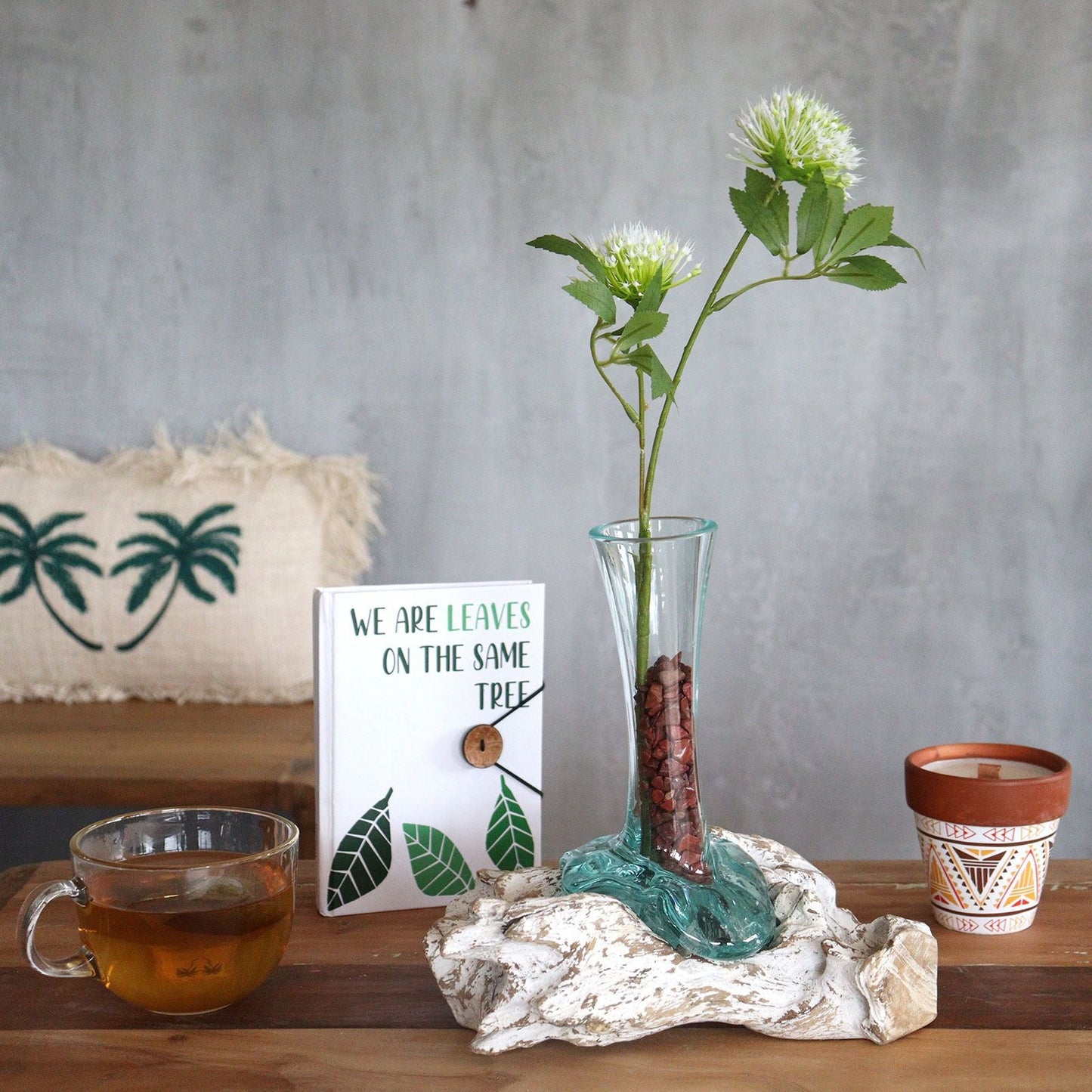 Gamal Wood Molten Glass Vase – Medium with recycled glass and Gamal wood base holding green flower stems on rustic table decor