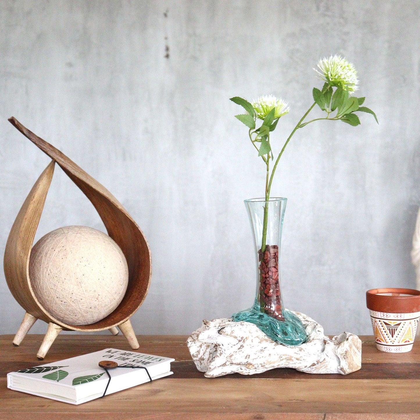 Gamal Wood Molten Glass Vase – Small with recycled hand-blown glass over Gamal wood, holding flowers on a wooden tabletop