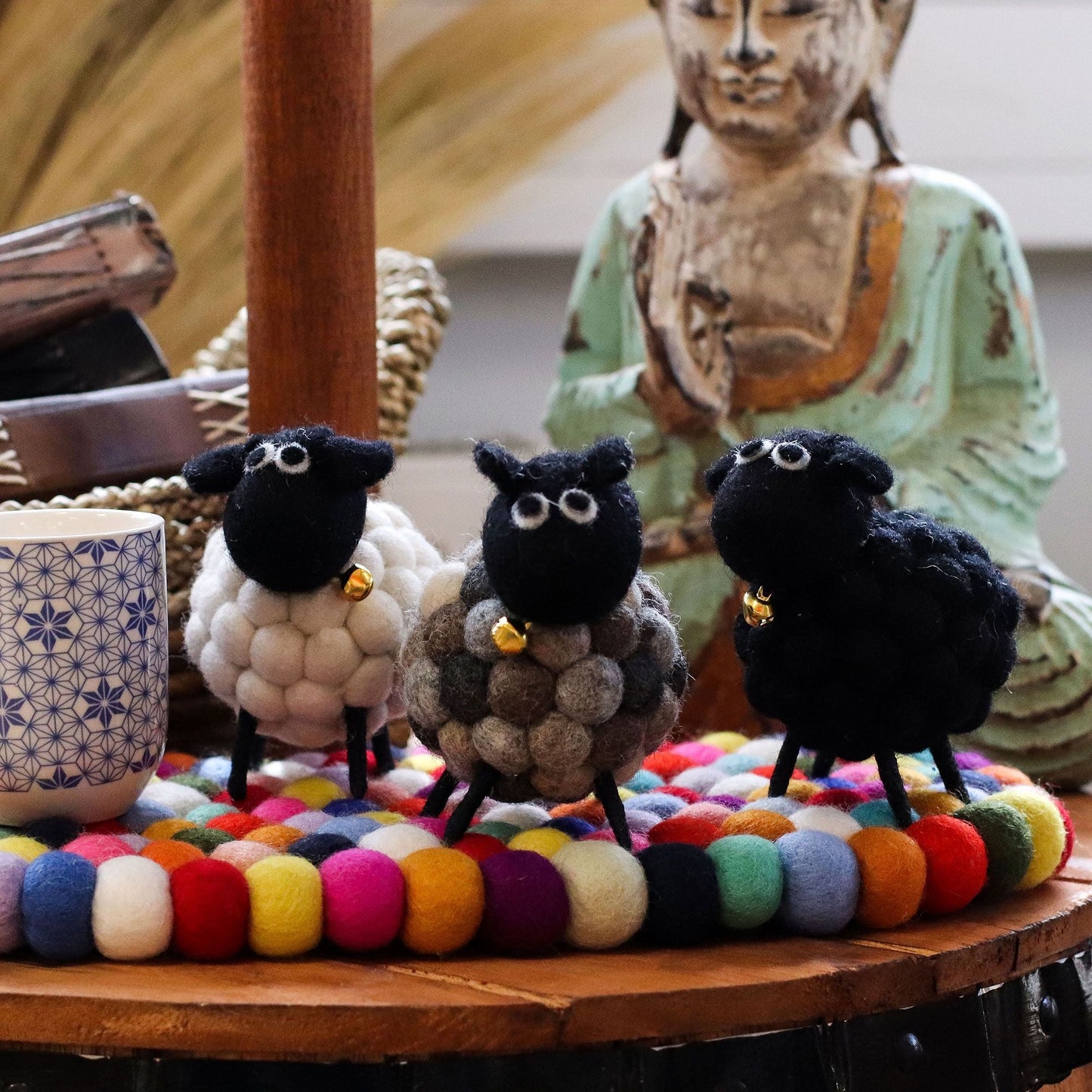 Charming White Felt Sheep – 12x8x10 CM handmade felt sheep decor on table with colorful felt mat