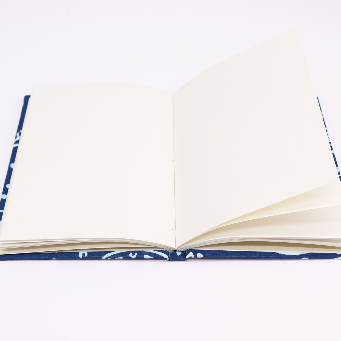 Alt Tag: Handmade Cotton Notebook – 20x15 CM Indigo Fish open view showing blank handmade paper pages and indigo cotton cover