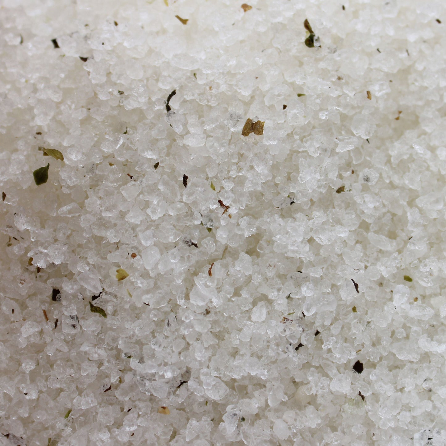 Alt Tag: Himalayan Mineral Bath Salt – 500G close-up of white mineral bath salt crystals with botanical specks, tea tree and lime scent blend