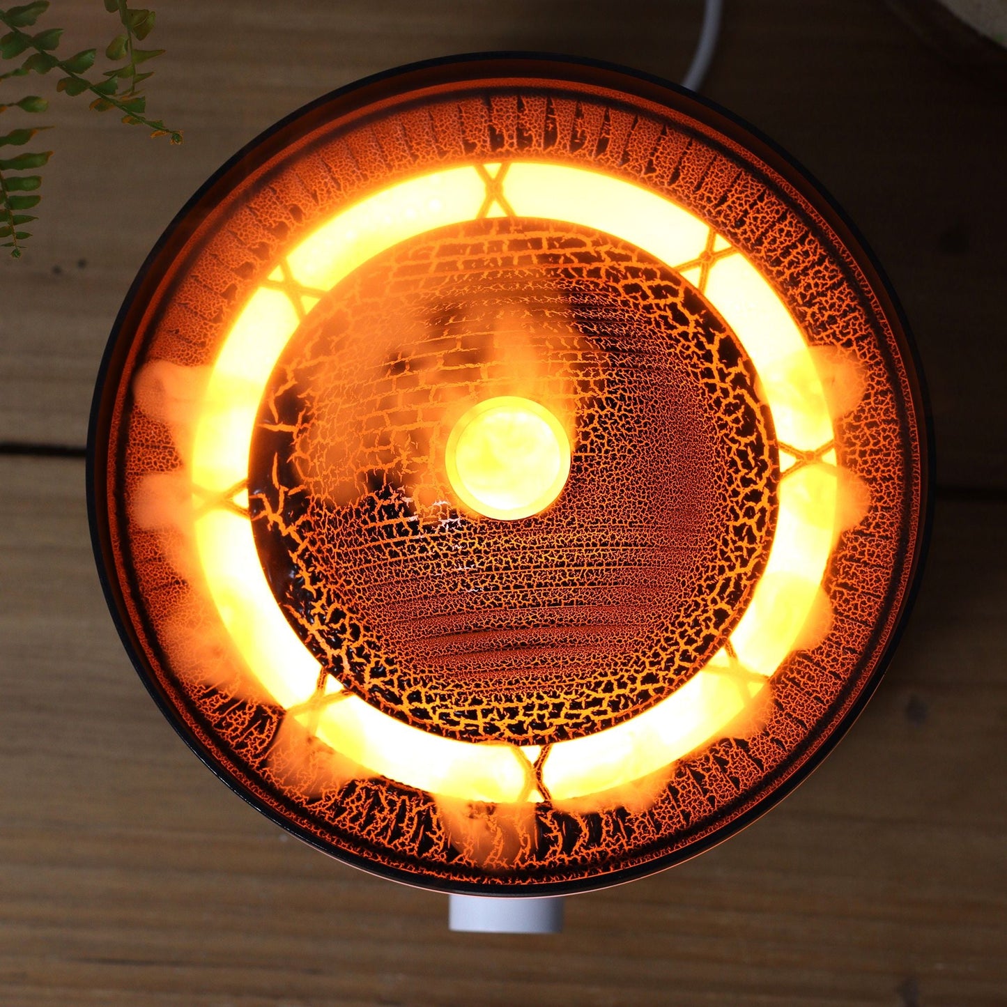 Large Volcano Effect Aroma Diffuser (Plug) – Two Colours with glowing volcano-style mist effect, top view on wooden surface