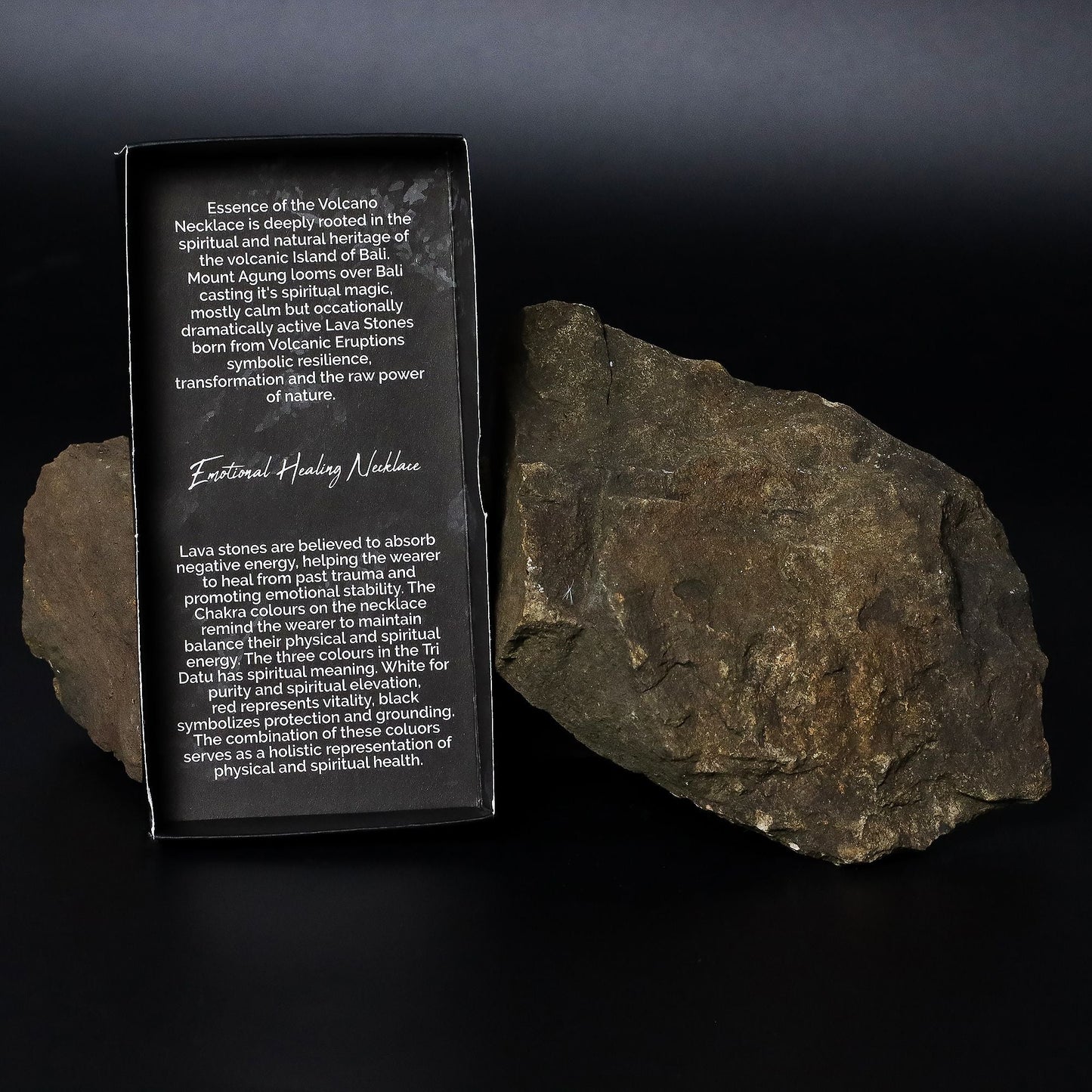 Lava Stone 7-Chakra Necklace – Emotional Harmonizing packaging box with lava stone rocks on black background
