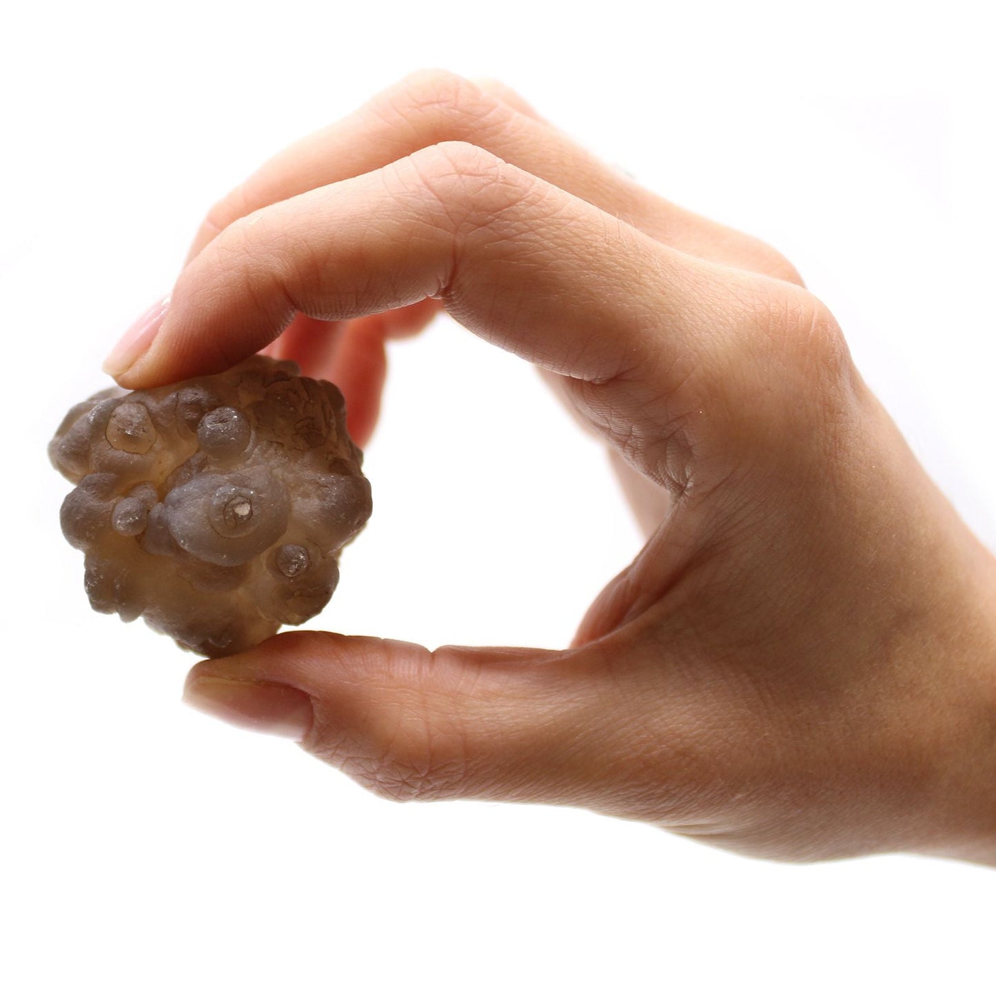 Alt Tag: Natural Chalcedony Mineral Specimens – 100-Piece Set, close-up of hand holding a natural chalcedony mineral specimen on white background