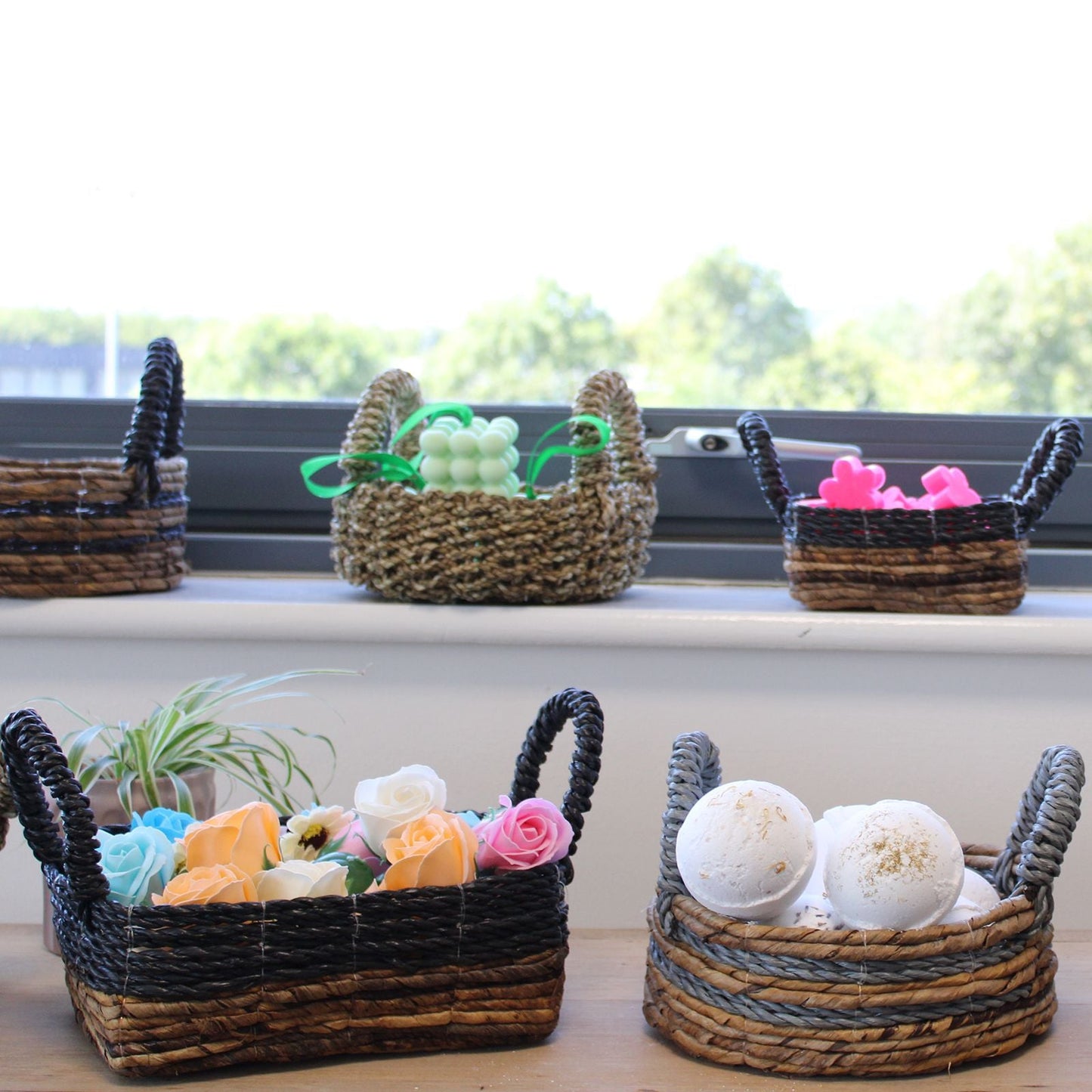 Alt Tag: Natural Seagrass Square Baskets – Set of 2 woven storage baskets set on windowsill with handles, organizing home items