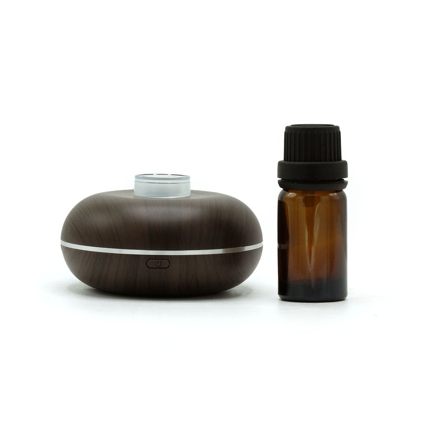 Alt Tag: Plastic Aroma Diffuser – USB-C Motion Sensor, compact waterless plastic diffuser with wood-grain finish beside amber essential oil bottle