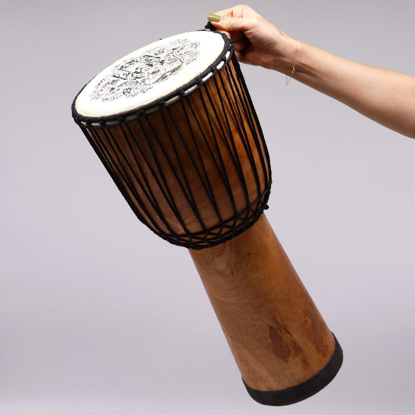 Suar Wood Djembe Drum – 50CM Hamsa Design held in hand, carved suar wood body with rope tuning and goat skin drumhead