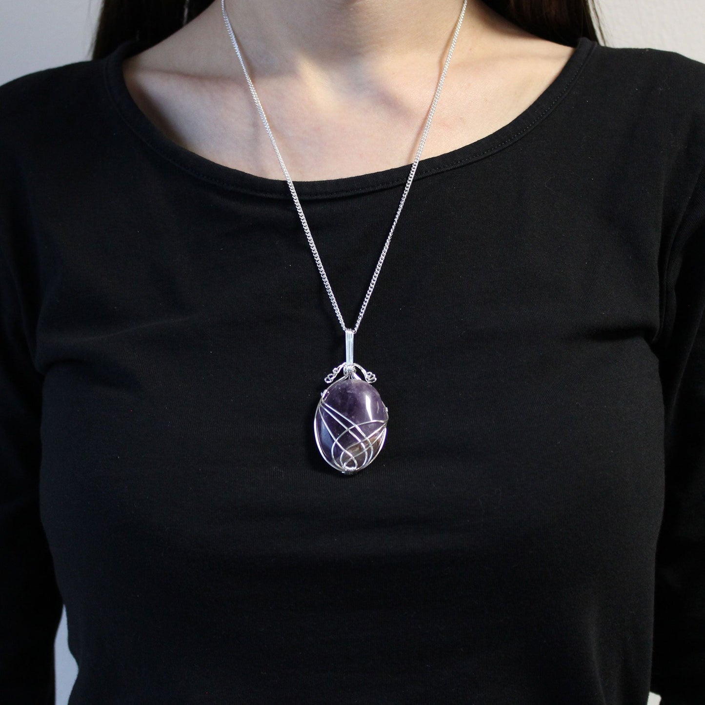Swirl Wrapped Gemstone Necklace - Amethyst purple amethyst pendant with swirl wire wrap on silver chain, worn on model