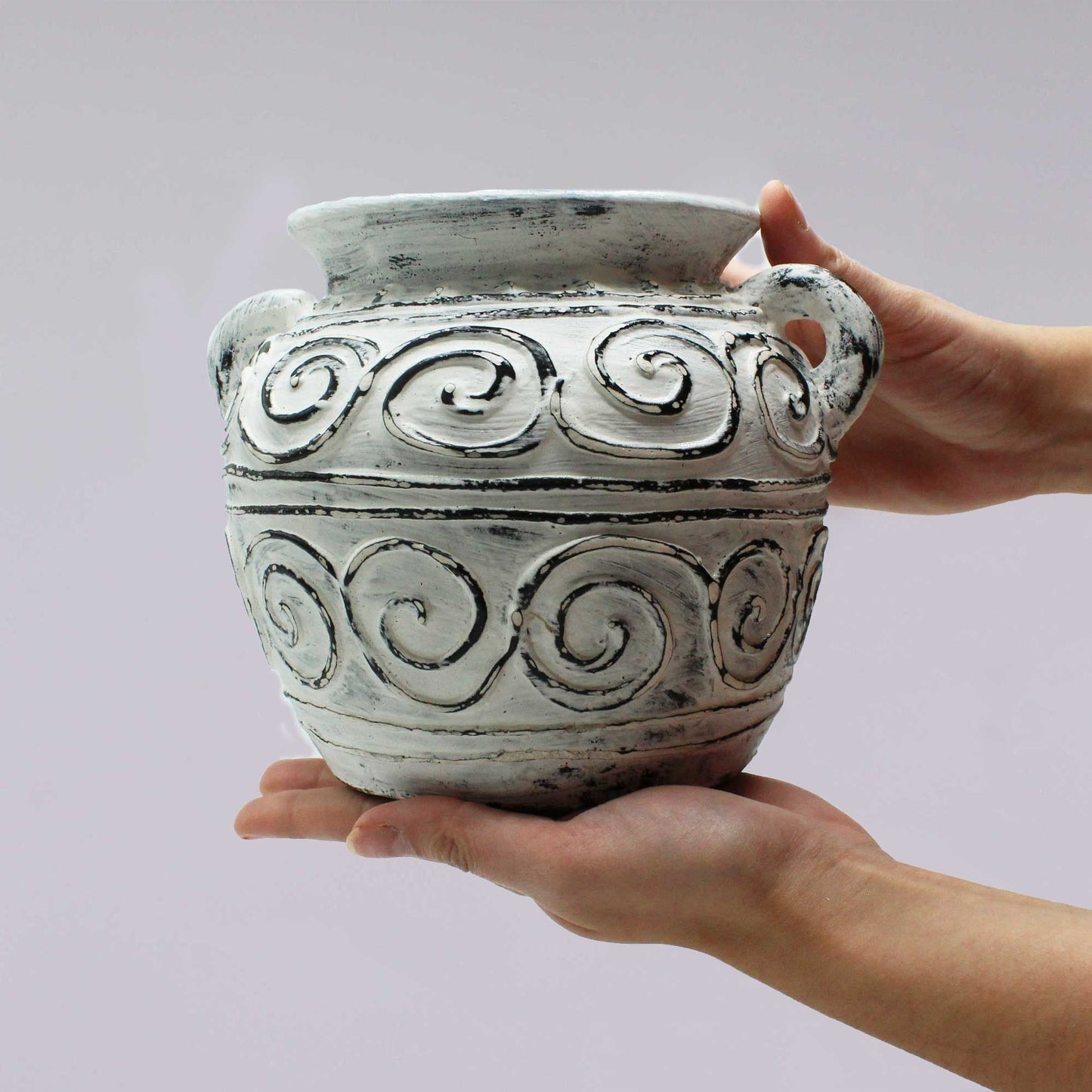 Alt Tag: Terracotta Greek Plant Pot – Cream 15CM cream planter with handles and swirl detailing, held in hands on neutral background