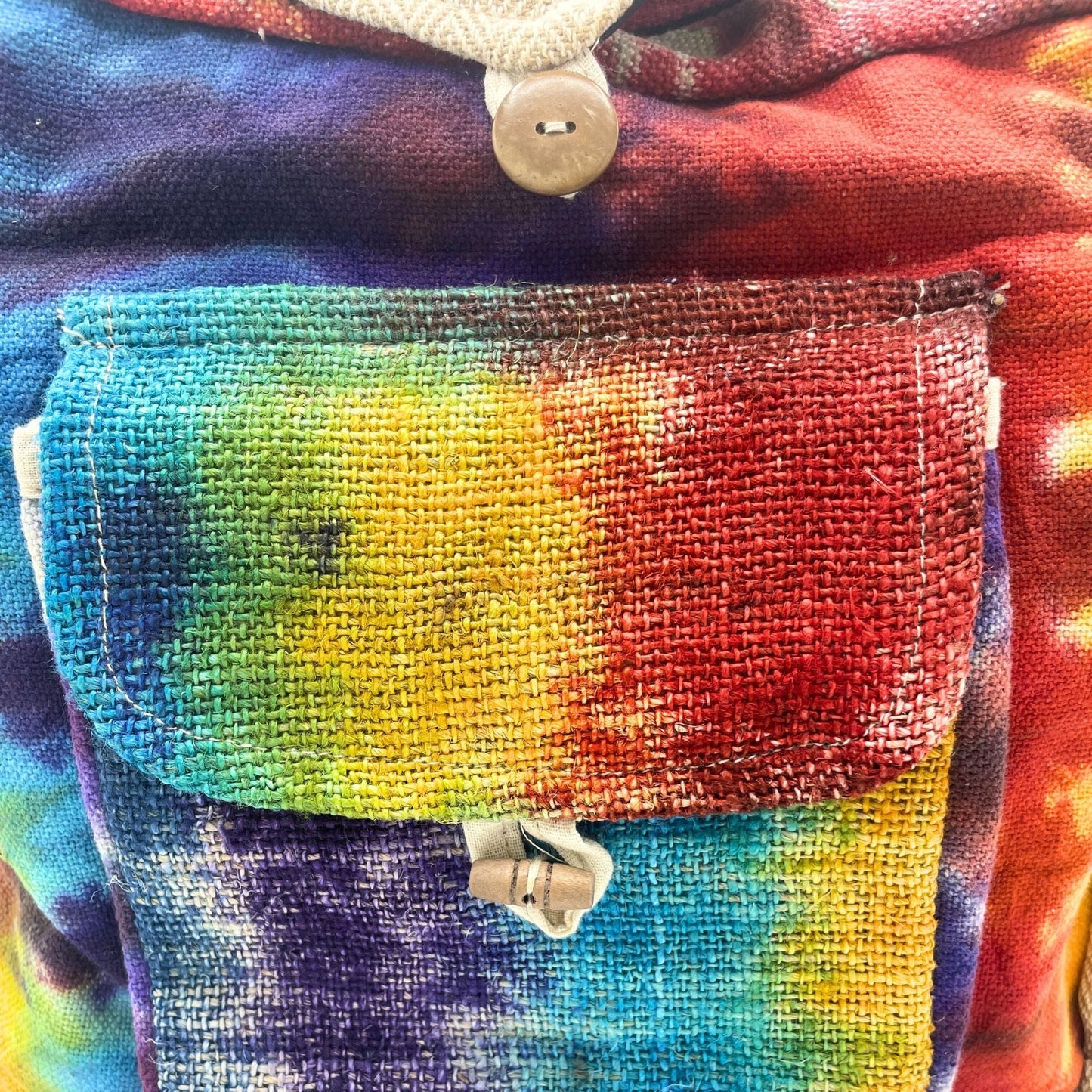 Alt Tag: Tiedye Hemp Study Bag – With Front Pocket close-up of colorful tie-dye front pocket flap and button closure