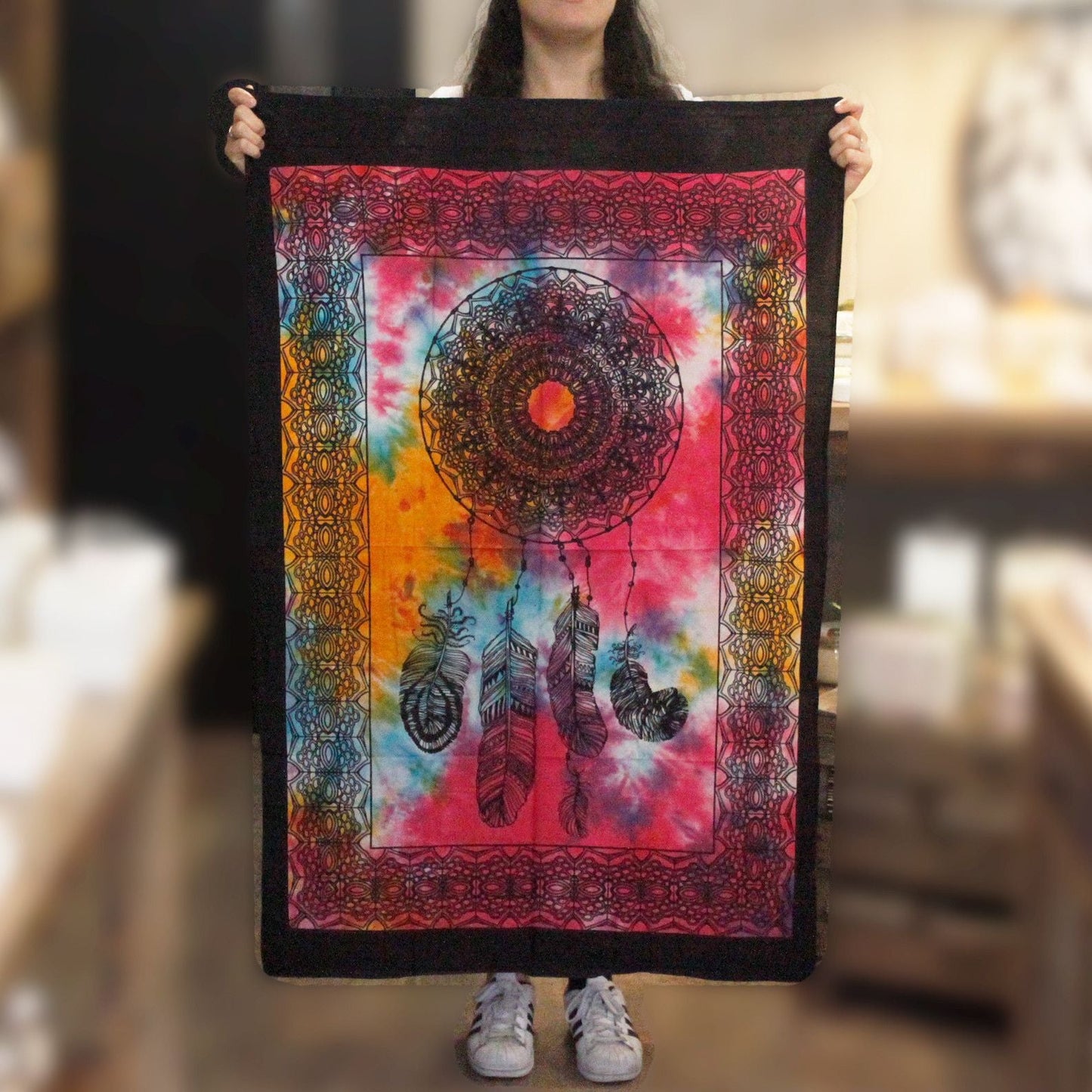 Alt Tag: Vibrant Cotton Dream Catcher Wall Art – 78x112 CM, colorful Indian cotton tapestry with dreamcatcher and feathers held up for scale