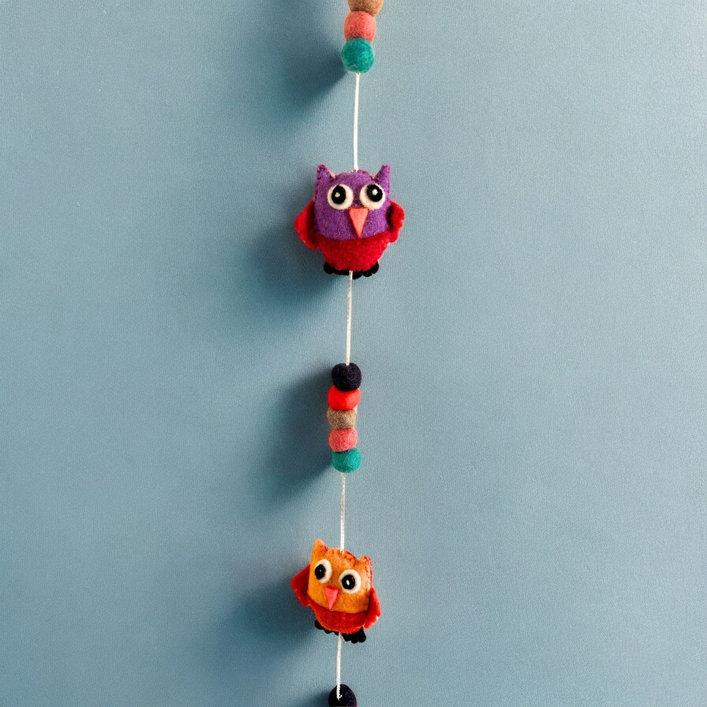 Alt Tag: Vibrant Felt Owl Wall Hanging – 110 CM handcrafted Nepal felt owls with colorful pom-poms vertical hanging decor