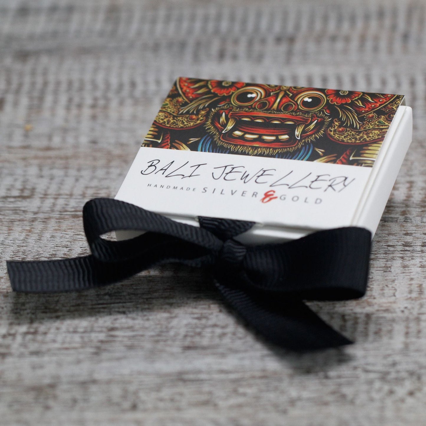 925 Silver & 18K Gold Hamsa Earrings – Hook 2.5CM jewelry gift box with black ribbon on wooden surface