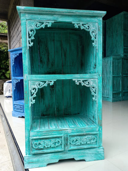 Alt Tag: Albasia Bathroom Cabinet – Turquoise Wash handcrafted albasia wood cabinet with open shelves and carved details