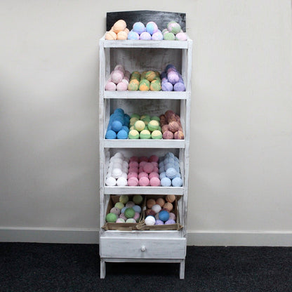 Albasia Wood Retail Display Stand – 5 Shelves with colorful bath bombs in a retail display rack
