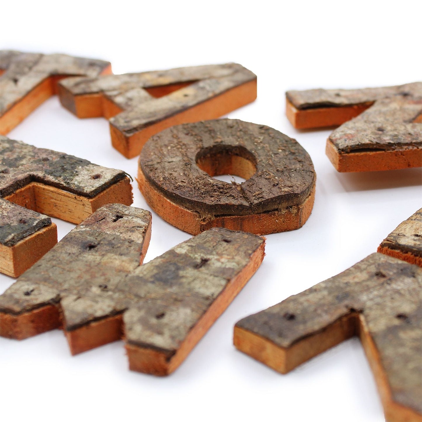 Albasia Wood Rustic Bark 'LOVE' Display – Set of 4, close-up of natural bark-textured wooden letters in warm rustic finish