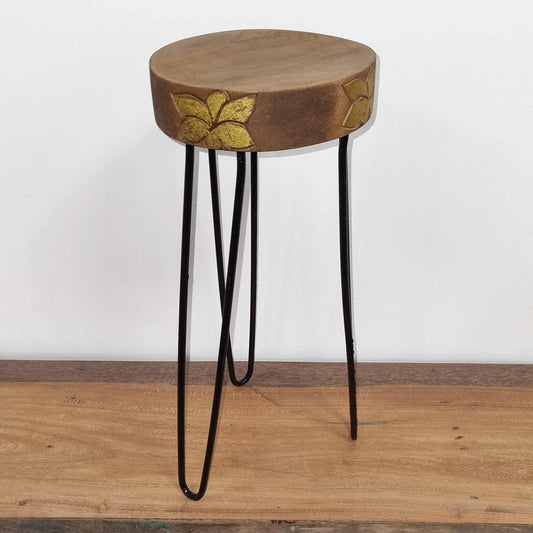 Albesia Wood Plant Stand – Natural with Gold Detail, round natural wood top with gold floral accents and black metal legs