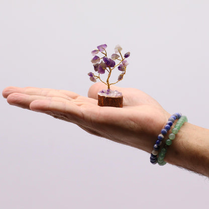 Alt Tag: Amethyst Gemstone Tree – 15 Stones, 6CM mini crystal tree with wood base held in hand, purple amethyst stones