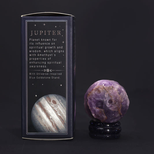 Amethyst Jupiter Gemstone Planet – 40MM Solar Goldstone Stand, purple amethyst sphere on glittering stand beside Jupiter gift box