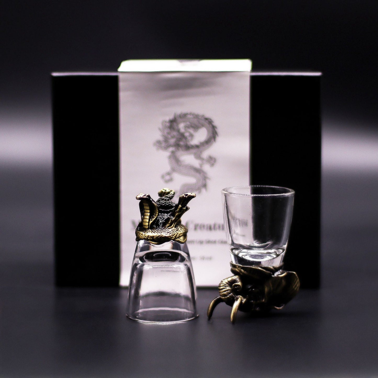 Antique Bronze Mystical Creatures Glasses – 50 ML set with dragon and octopus-themed bronze-style holders, clear shot glasses