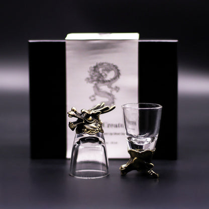 Alt Tag: Antique Bronze Mystical Creatures Glasses – 50 ML set, clear shot glasses with antique bronze creature stand, product box background