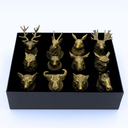 Alt Tag: Antique Bronze Shot Glasses – 25ML Set of 12 with forest animal head designs displayed in a black gift box