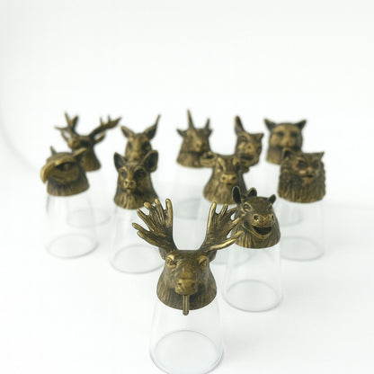 Alt Tag: Antique Bronze Shot Glasses – 25ML Set of 12, forest animal head brass tops on clear glass shot glasses