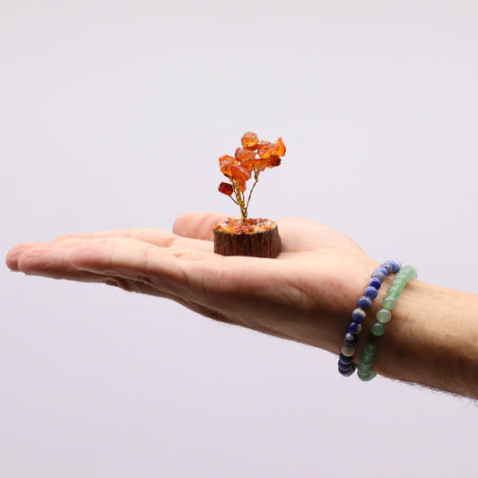 Alt Tag: Assorted Mini Gemstone Trees – Wood Base, 15 Stones mini gemstone tree with orange stones on wood base held in hand