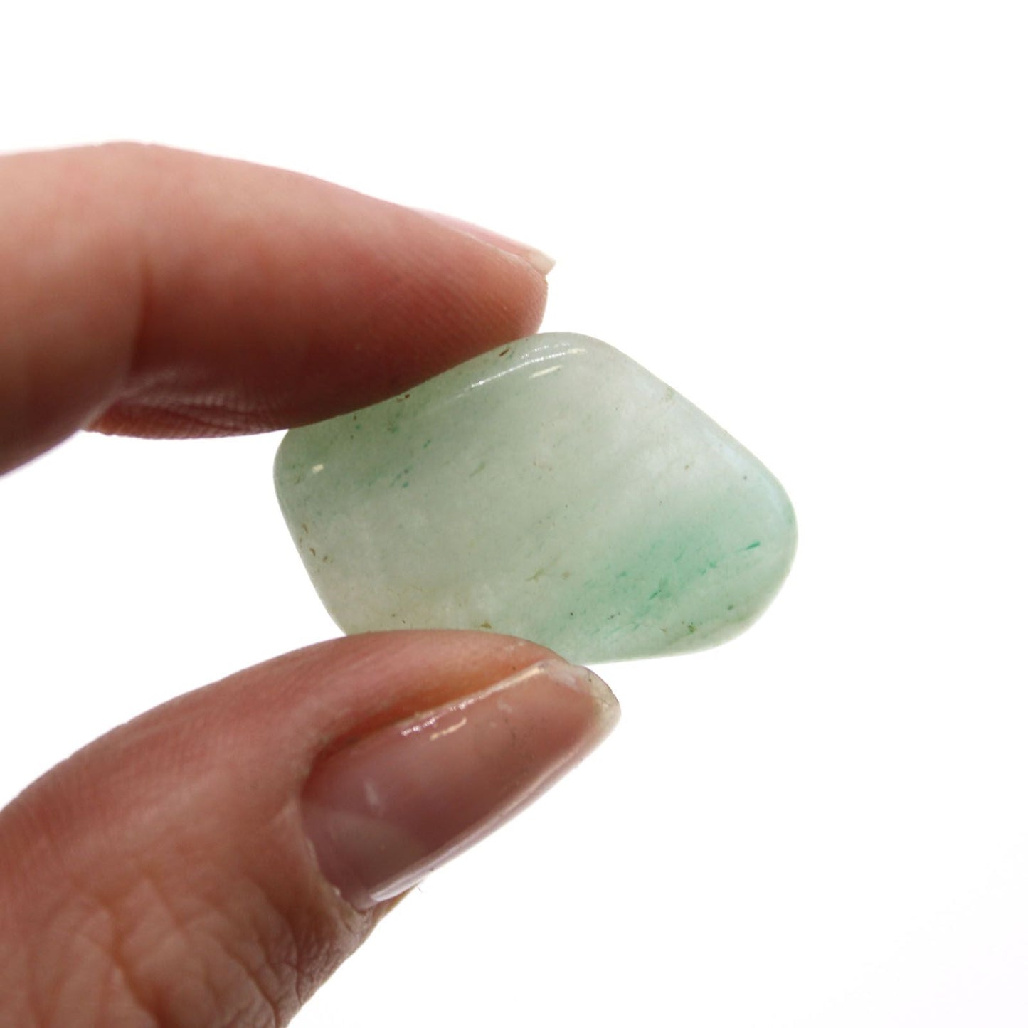 Gemstone Tumble Stones – 24-Piece Aventurine Set, close-up of polished green aventurine stone held between fingers