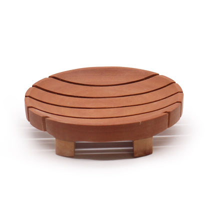 Round Naseberry wood soap dish 10x2 cm with carved drainage slots, handcrafted bathroom accessory