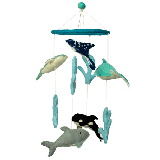Handmade felt nursery mobile with dolphins and sea life figures hanging from a circular hoop