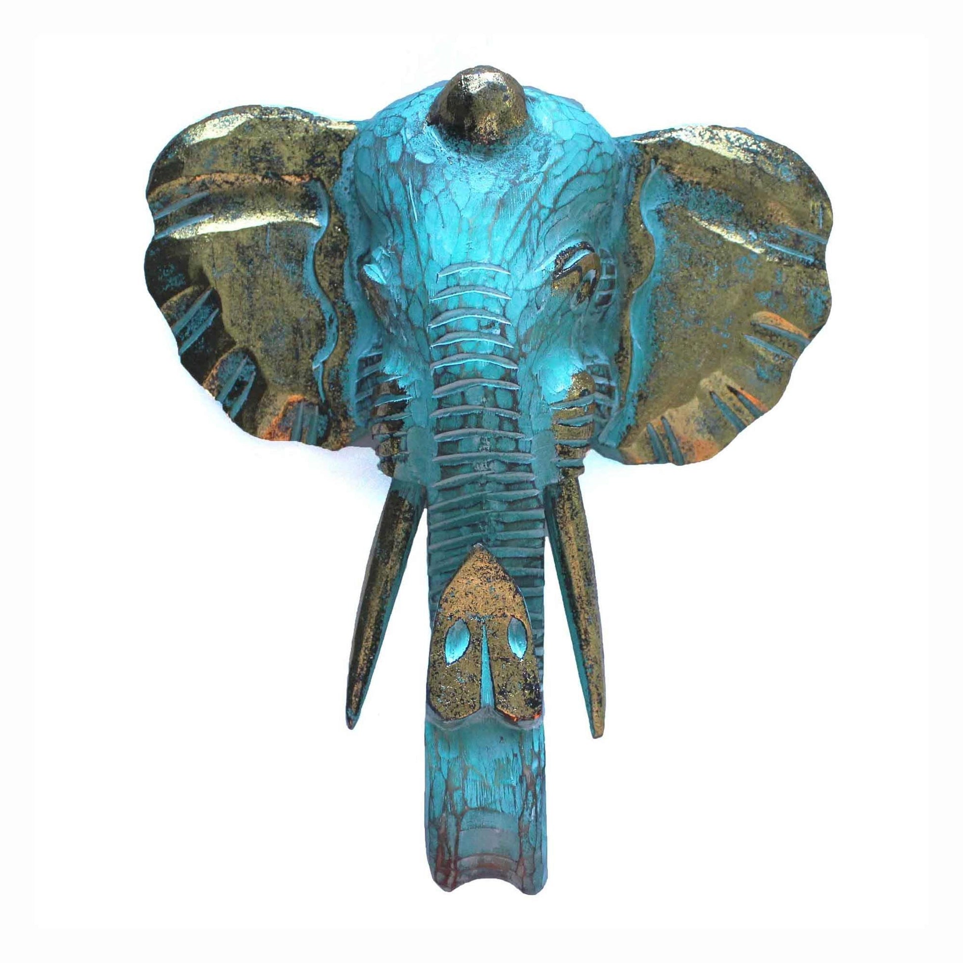 Large gold and turquoise elephant head wall decor mounted on a wall