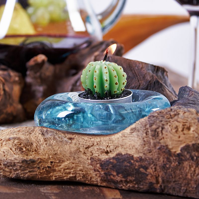 Handmade Bali candle holder with recycled blown glass melted over sustainable Gamal wood base, each piece unique.