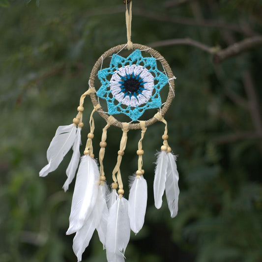 Pastel blue 12cm macramé dream catcher handmade in Bali with cotton and feathers, available in assorted colour variations