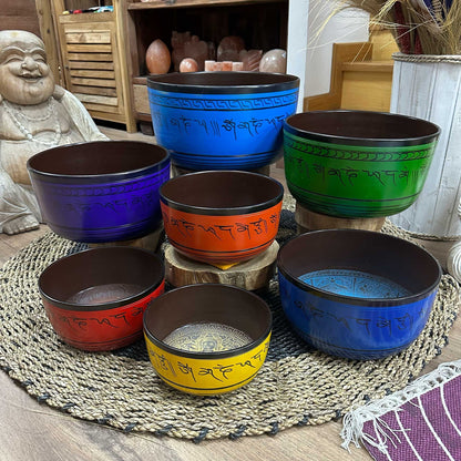Set of seven large Tibetan chakra singing bowls (19.5–35cm) with vibrant symbols and mallet for meditation