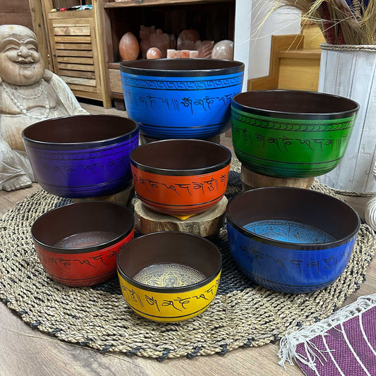 Set of seven large Tibetan chakra singing bowls (19.5–35cm) with vibrant symbols and mallet for meditation