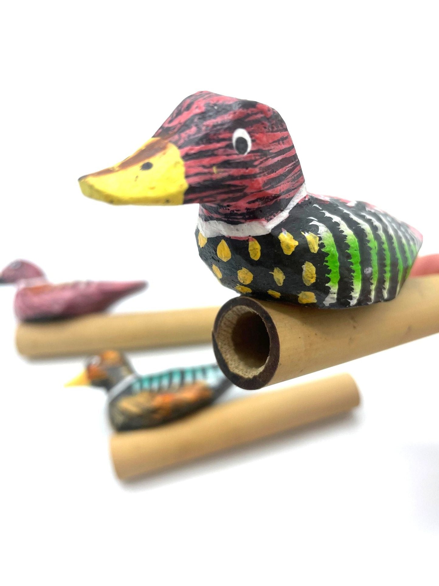 Alt Tag: Bamboo Bird Whistle – 10x4.5x1.5 CM, handcrafted bamboo bird whistle with painted duck design and pocket-size shape