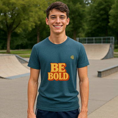 Be Bold Youth 100% Organic Cotton T-Shirt on teen model, teal shirt with BE BOLD graphic at skate park