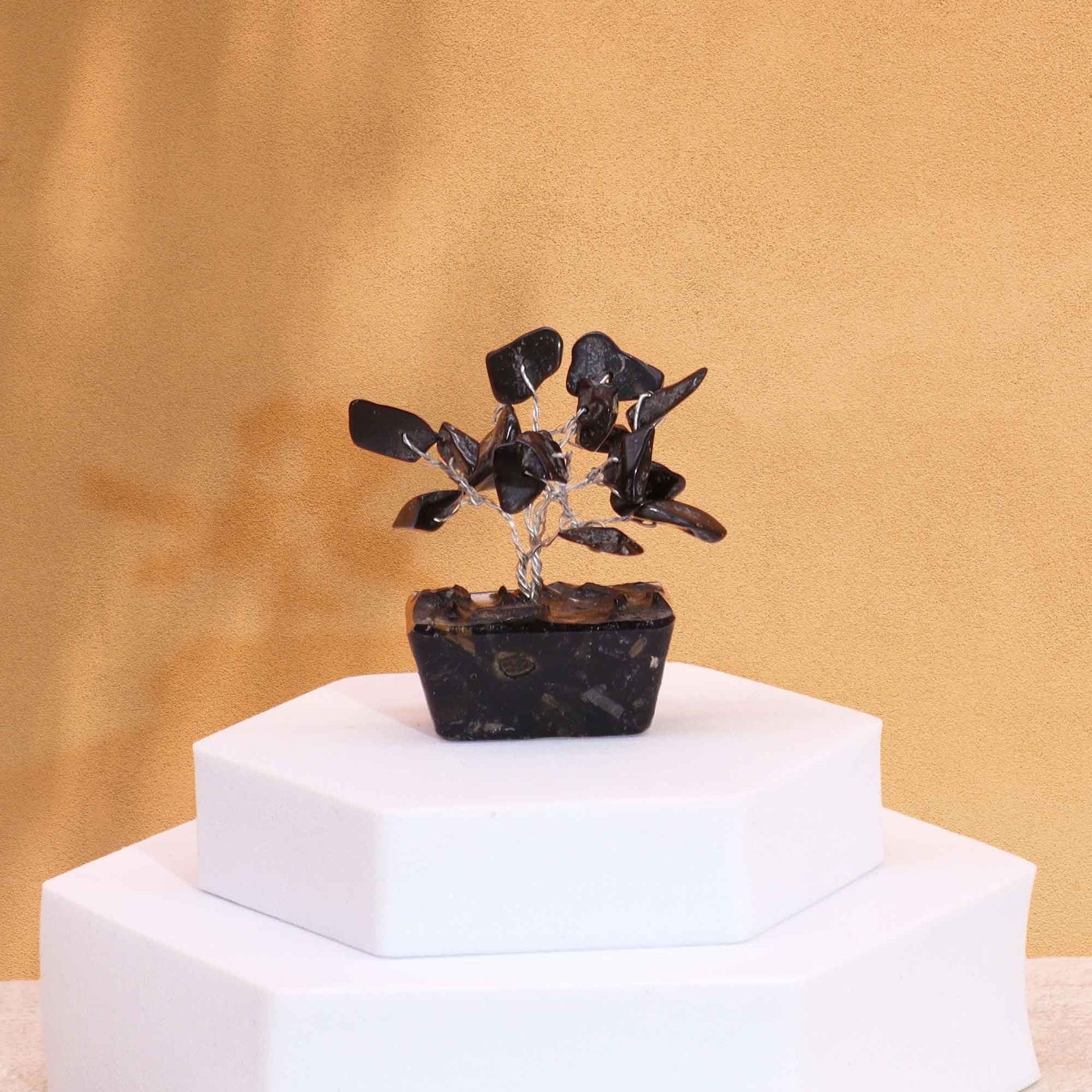 Alt Tag: Black Agate Mini Gemstone Tree – 15 Stones on orgonite base, mini black agate crystal bonsai decor on white pedestal