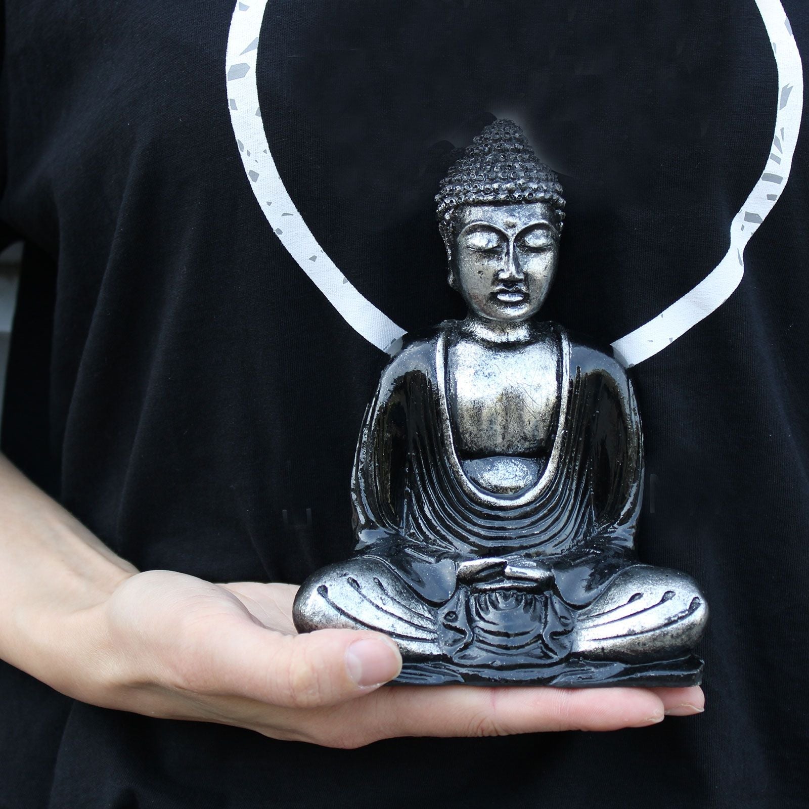 Black & Grey Buddha Statue – Medium seated meditation figurine with modern black and grey finish, displayed on hand