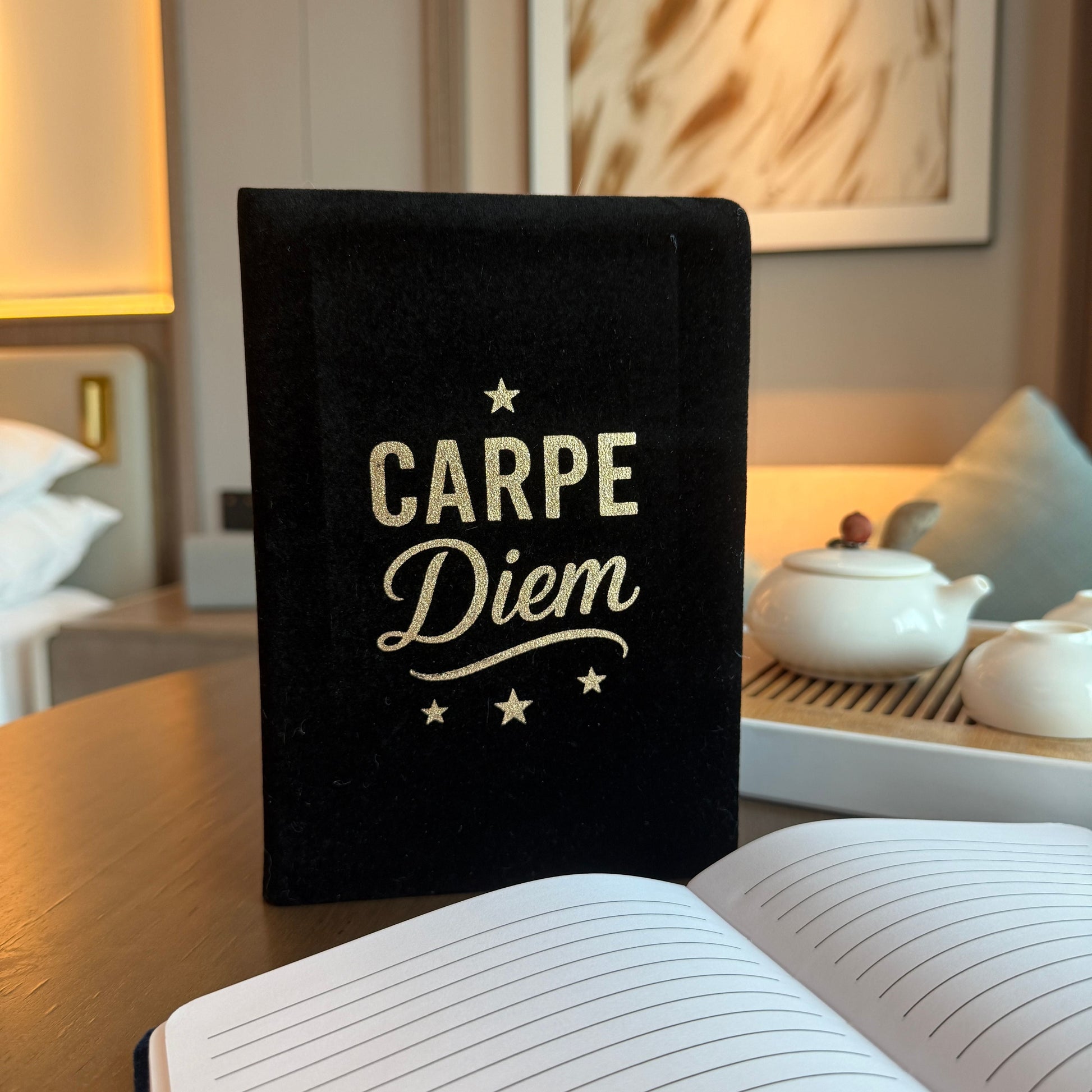 Alt Tag: Black Velvet Notebook – 80 Pages Carpe Diem, black velvet cover with gold “Carpe Diem” lettering, lined pages open