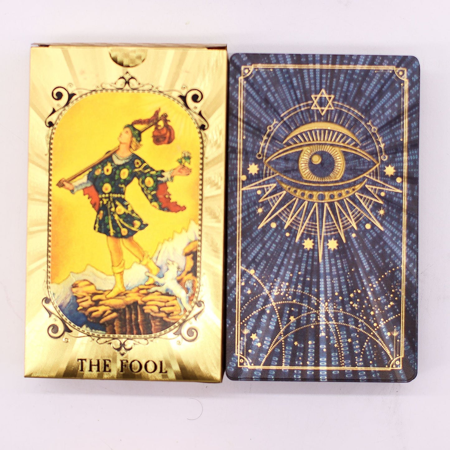 Alt Tag: Blue & Gold Foil Tarot Card Set – All Seeing Eye (with Booklet) caja The Fool y reverso azul con ojo y detalles dorados