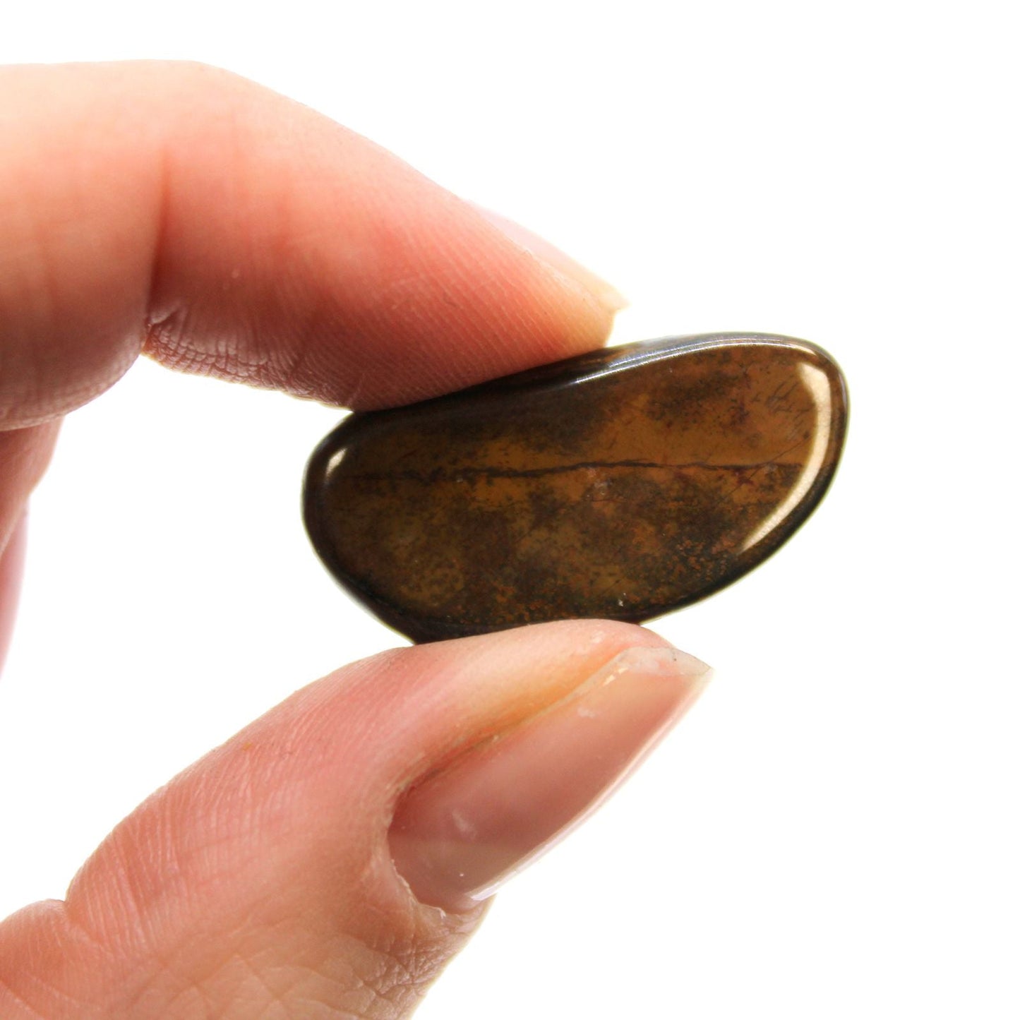 Blue Tiger's Eye Gemstone – 24 Small Tumbles polished small tumble stone held between fingers, natural blue-brown chatoyancy